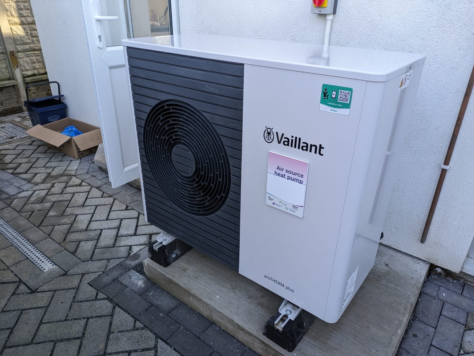 Air source heat pump outside a terraced house